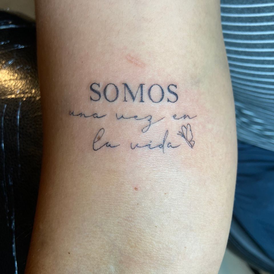 Image of a saying tattood on the arm
