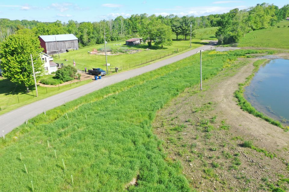 2025 arial drone looking north west homestead and pond edge