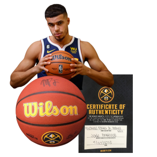 Denver Nuggets Michael Porter Jr. with a signed basketball and certificate of authenticity