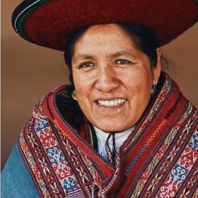 A Quechua woman in her native garb who helps to process the alpaca and weave PAKA's clothing 