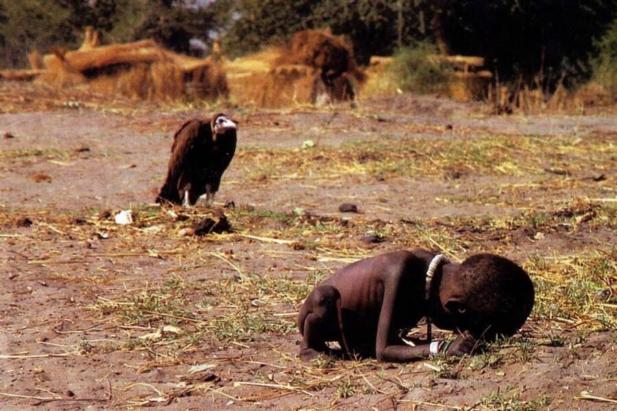 The 1993 photograph by Kevin Carter showing a starving Sudanese child with a vulture watching nearby.