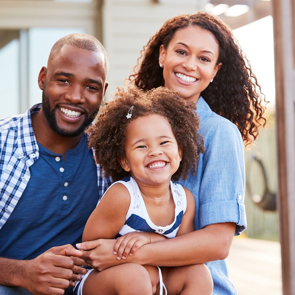 Bigstock young black family embracing o 236699197