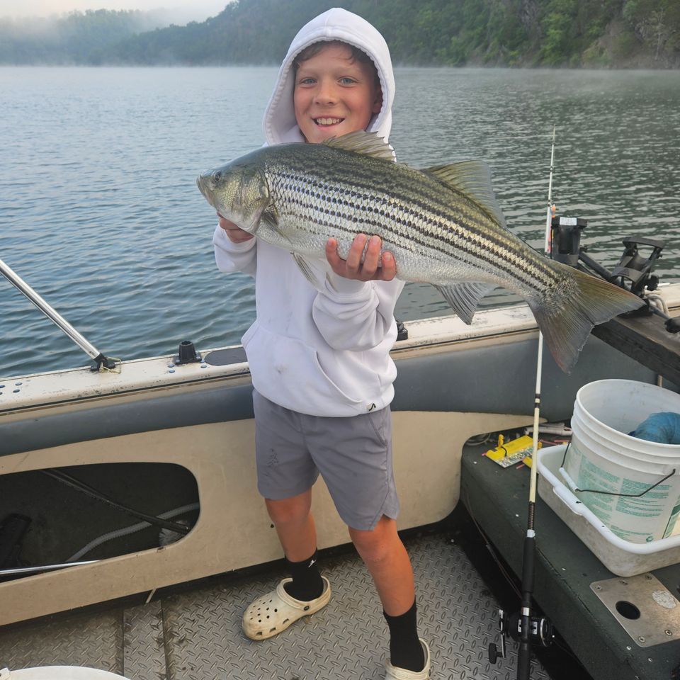 boy fishing on boat