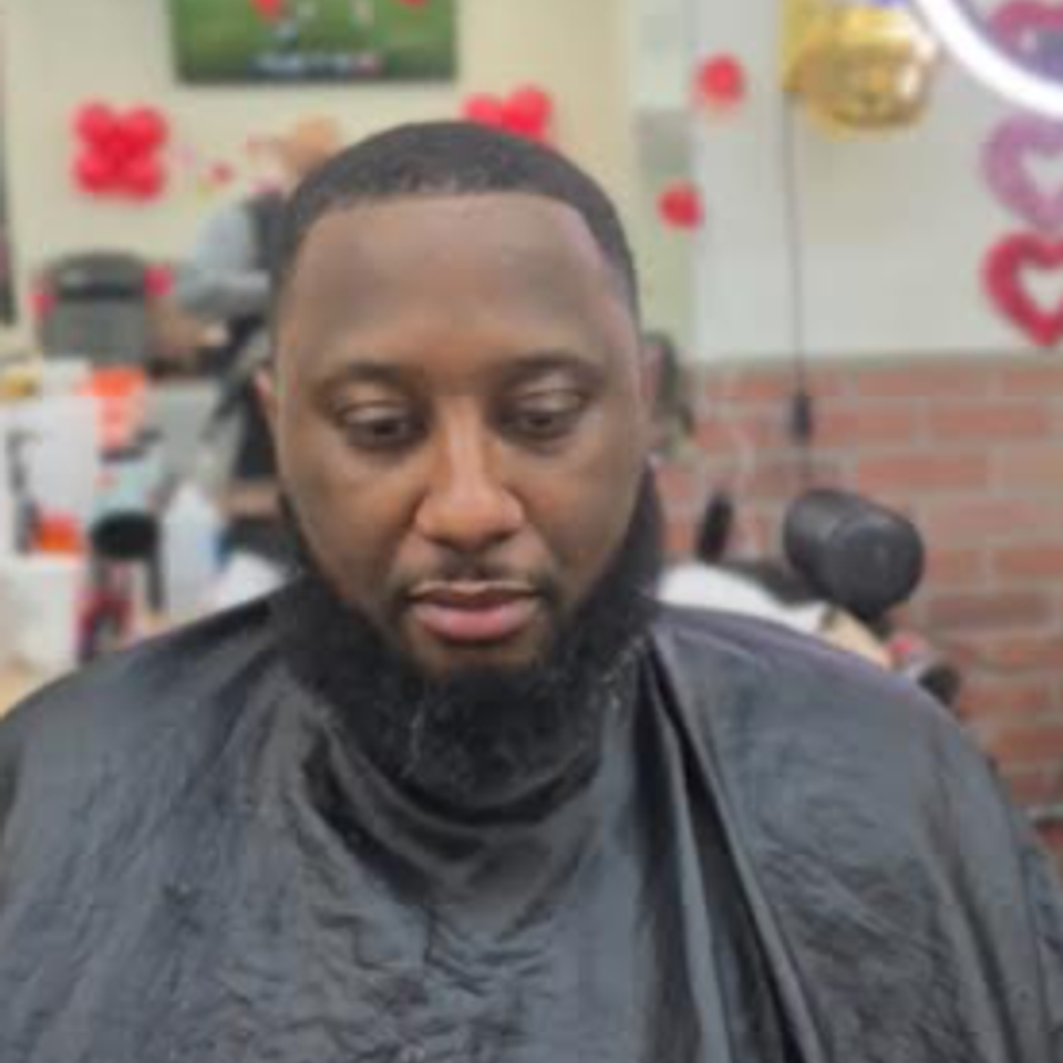 Front view of a wave haircut with taper fade by Jeff Barber Services in the Bronx