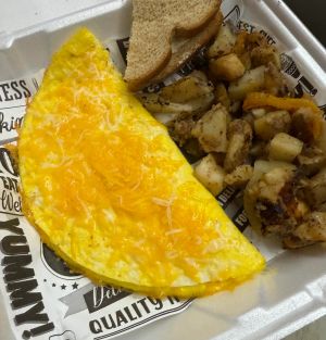 Cheese omelet served with toast
