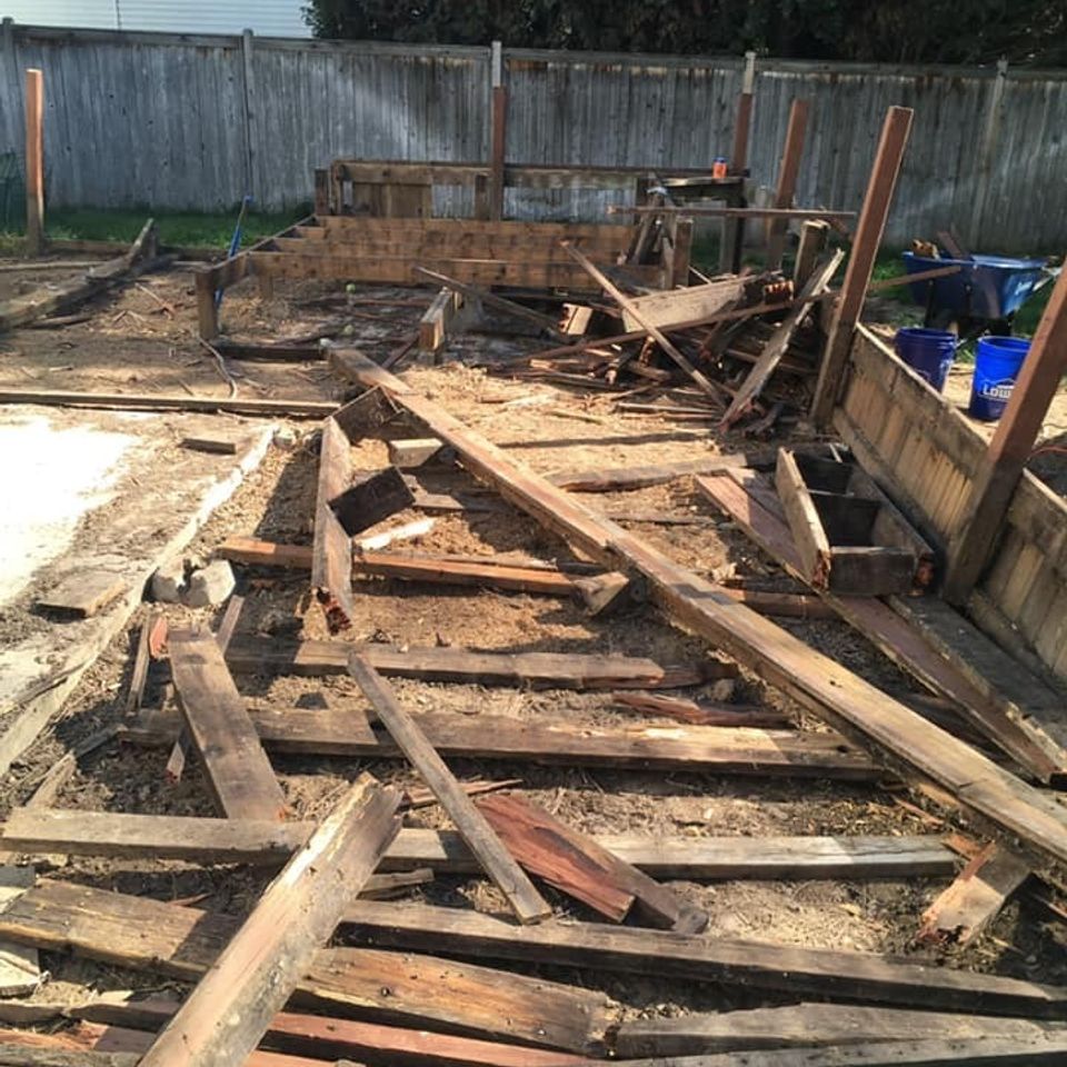 Backyard deck removal before | Platinum Concrete Construction