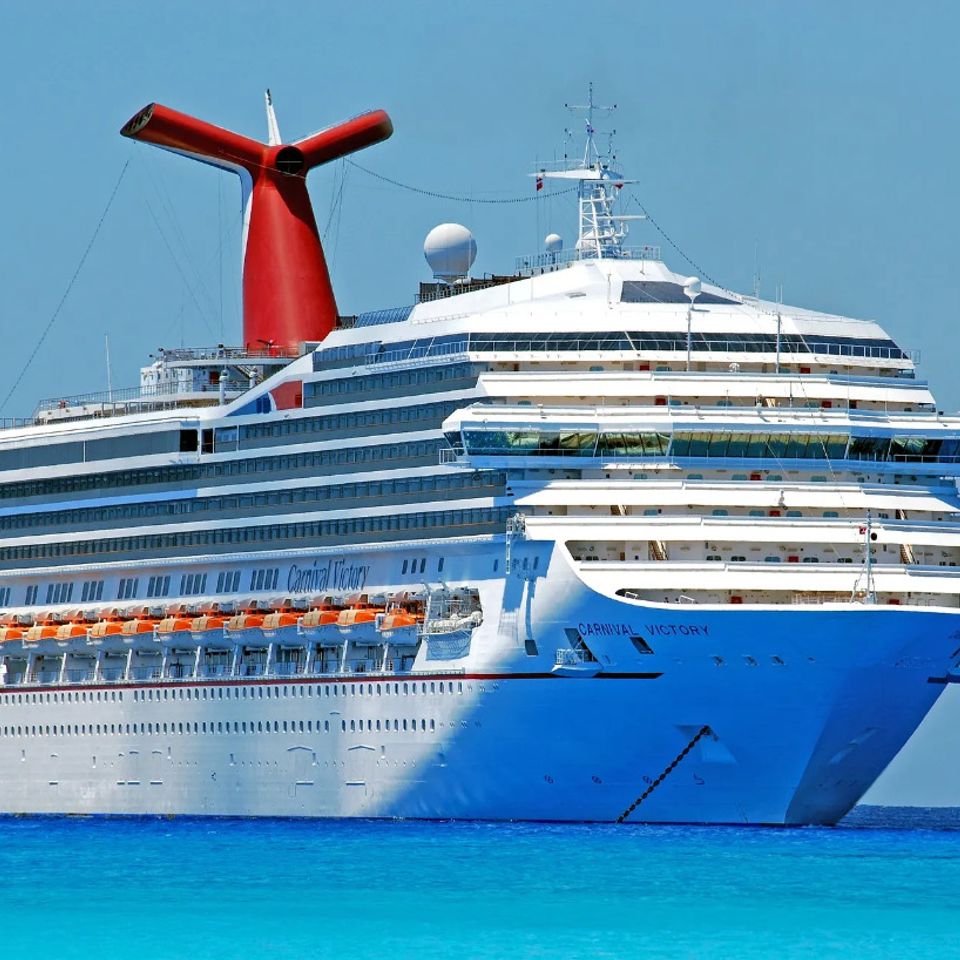 Carnival Ship cruising the blue tropical waters of the Carribean.