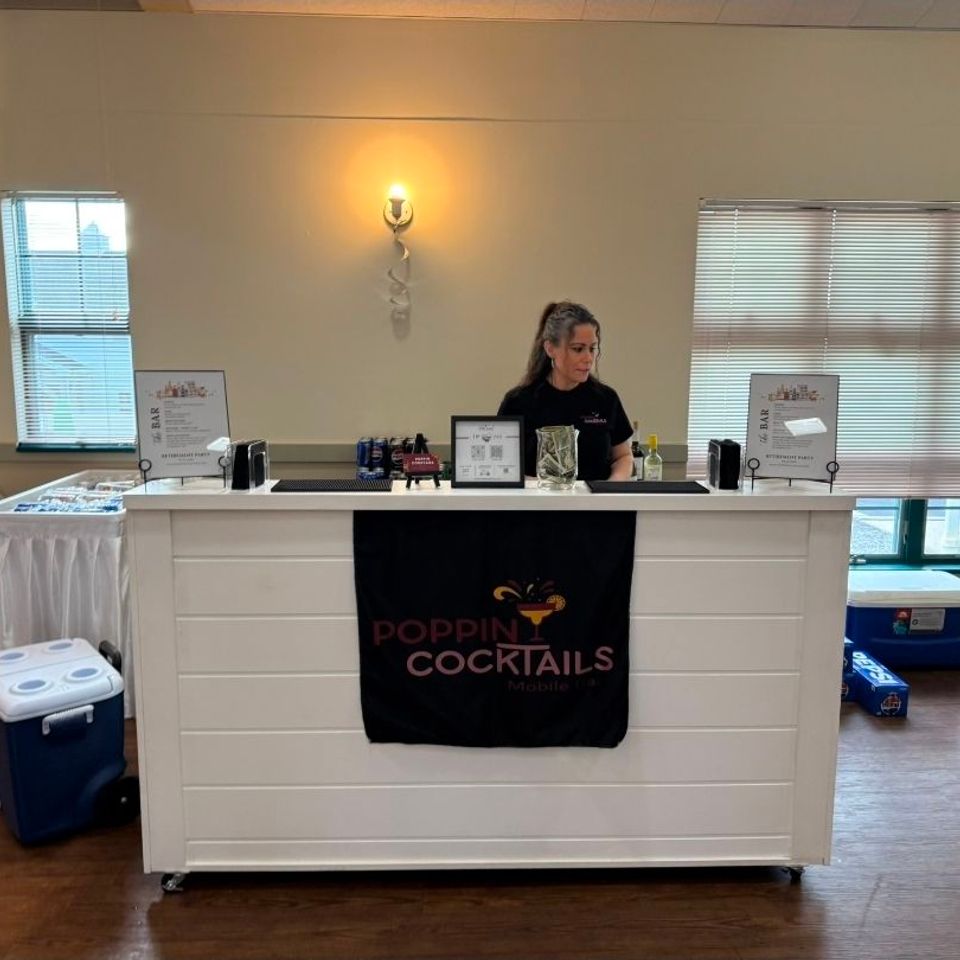 Poppin Cocktails owner working behind a bar