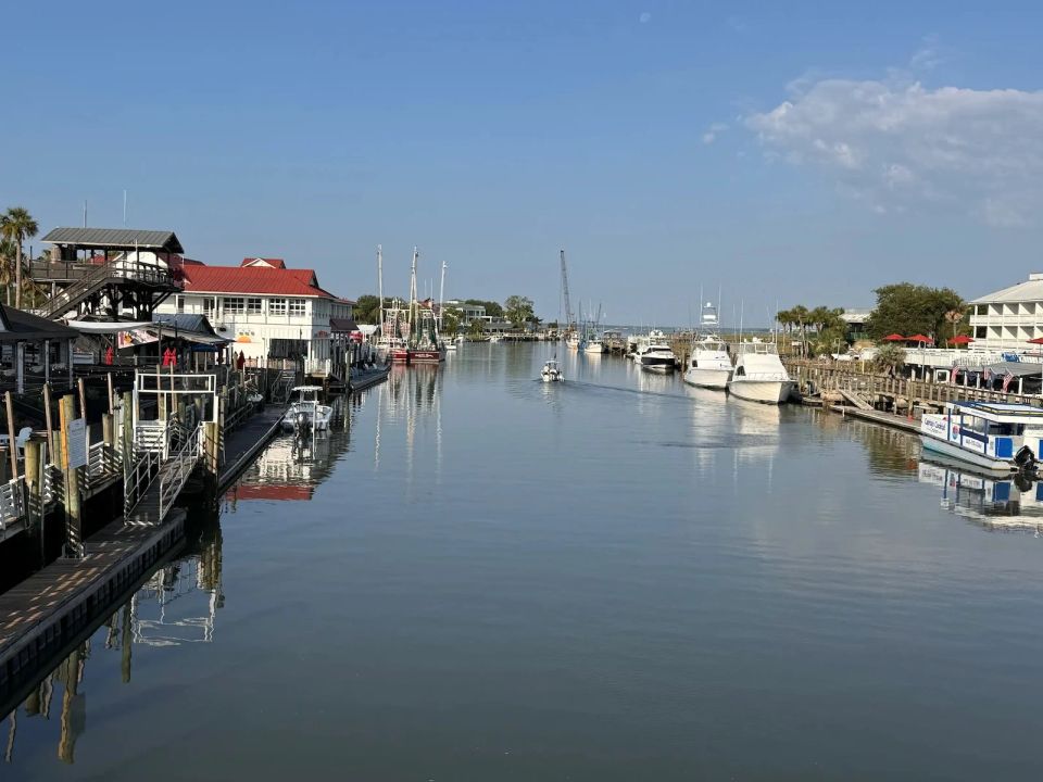 Shem Creek waterfront and marina in Charleston, SC with boats docked along the boardwalk