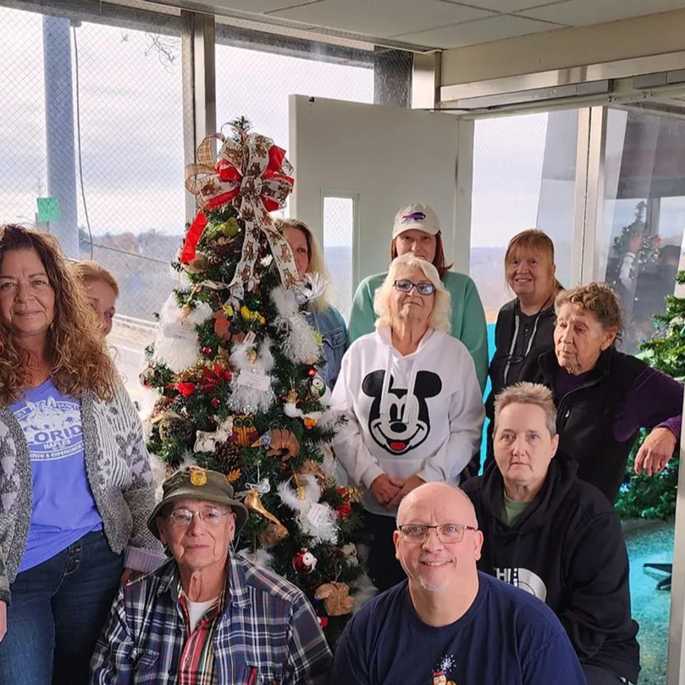 Wild kritters volunteers  decorating Christmas tree
