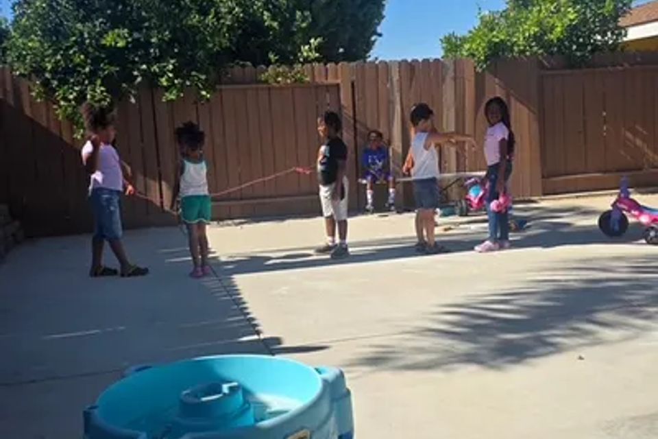 Children playing in the backyard of the day care
