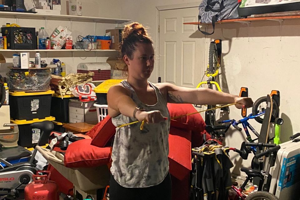 Image of Gym Truck Chico client exercising in her garage for convenience and privacy