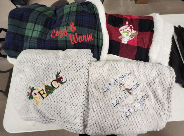 Blankets and afghans with embroidery