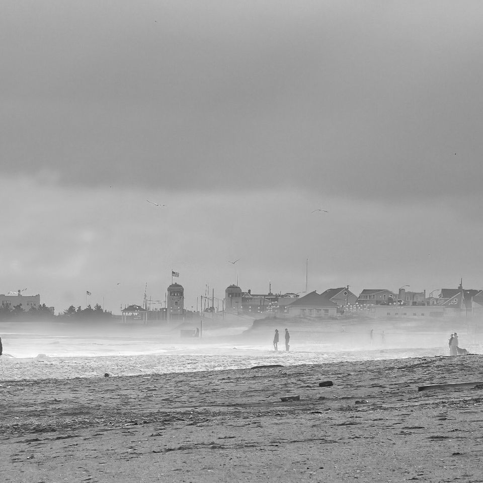 Walk on a cloudy beach