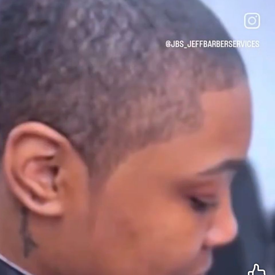 Female customer after receiving a fresh fade from Jeff Barber Services