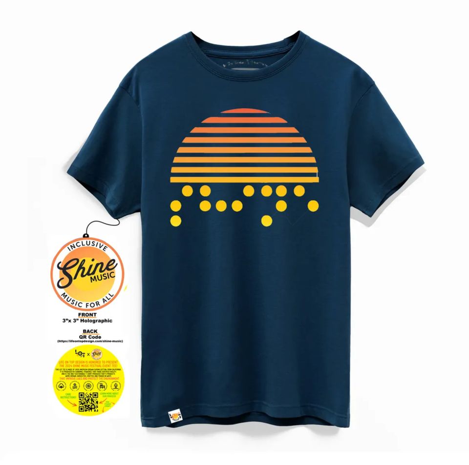 SMF24 T-shirt features a stylized sun with horizontal stripes in shades of orange and yellow, resembling a sunrise. Below the sun, there are yellow dots that spell SHINE in Braille, on a navy short-sleeved tshirt.