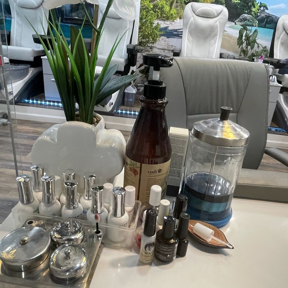 A working station at Nail Lovers with beauty products on the table