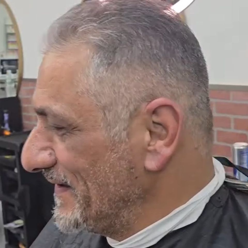Classic low fade haircut for older client at Bronx NY barbershop Jeff Barber Services