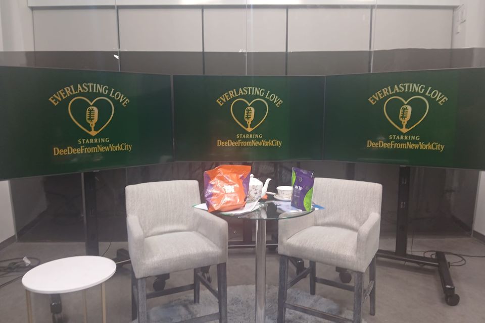 Everlasting love podcast set with 2 grey high chairs and a coffee table