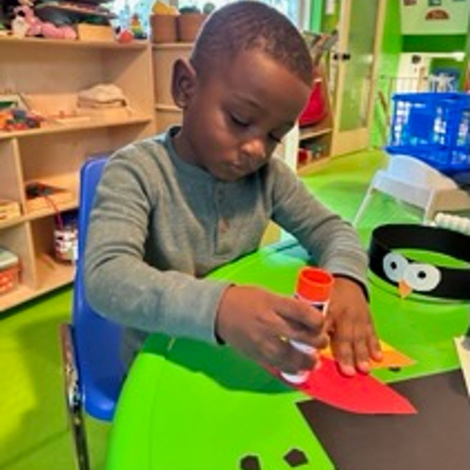 Boy making bird hat brenda family daycare