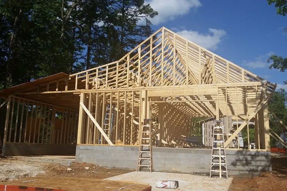 Framing of a custom built home by PAC Custom Home Builders of Timberlake, NC.