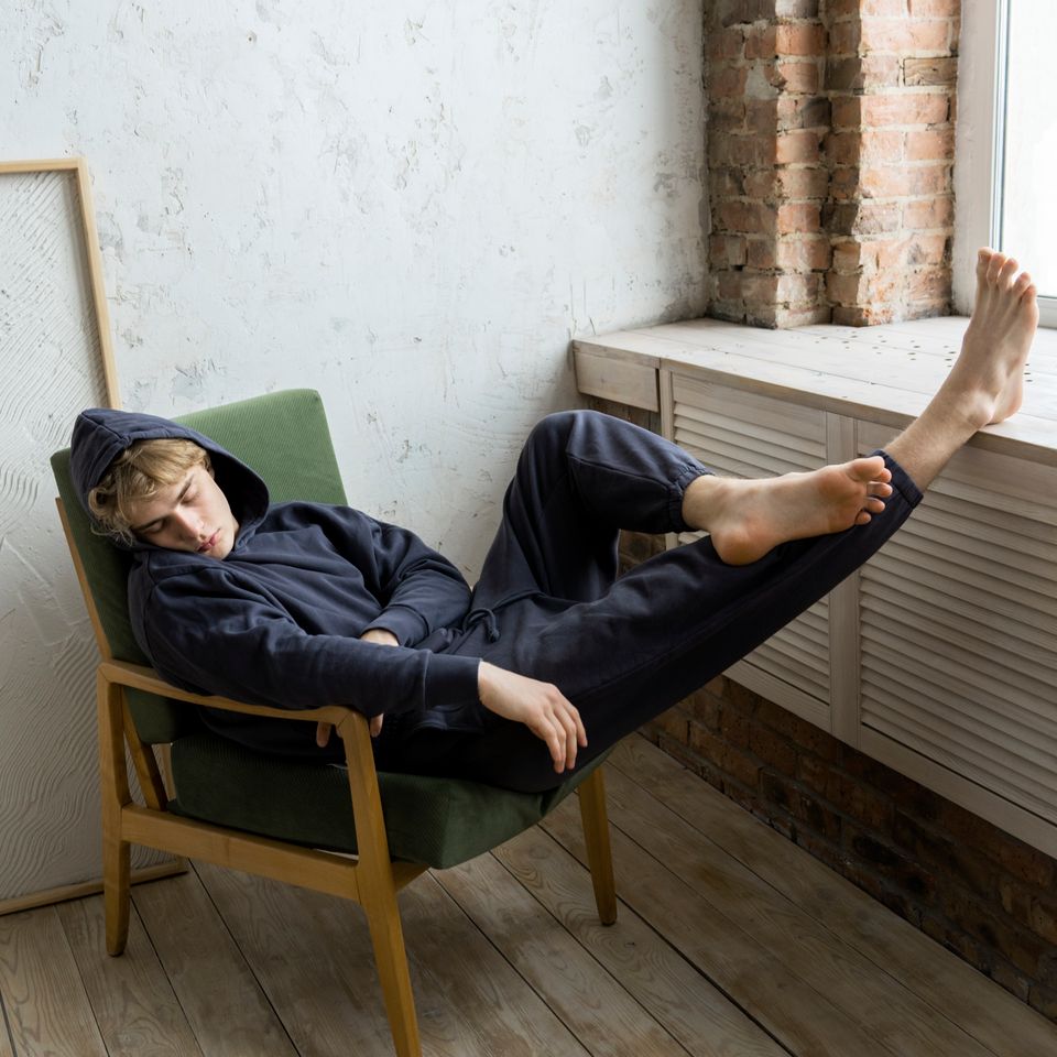 Young adult sleeping chair