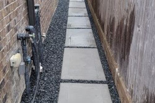 Stepping‑stone walkway with decorative gravel in Cypress, TX