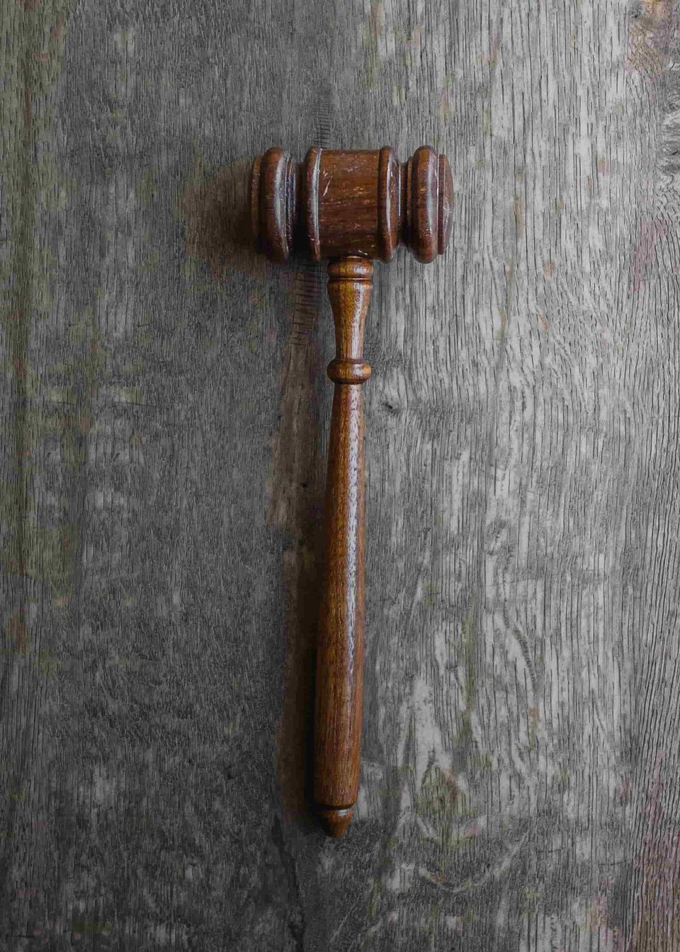 Old judge's gavel on a wood desk