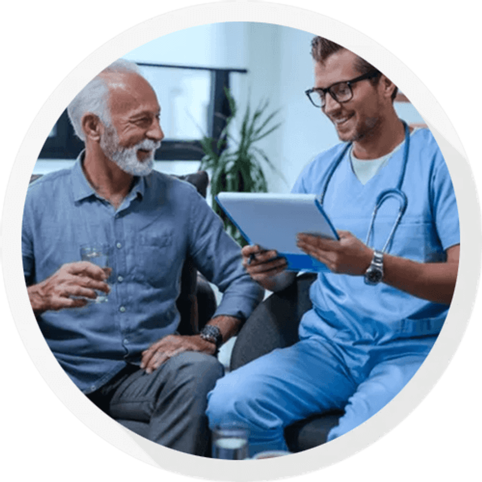 Old man talking to nurse