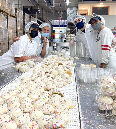 Group photo of some of the Toni's Own Cookies employees, including Toni herself