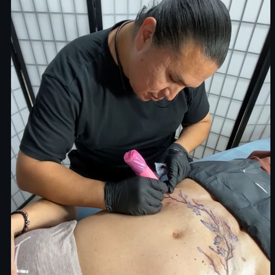 Adrian Anderson Tattoo Artist Creating A Tummy Tuck Tattoo