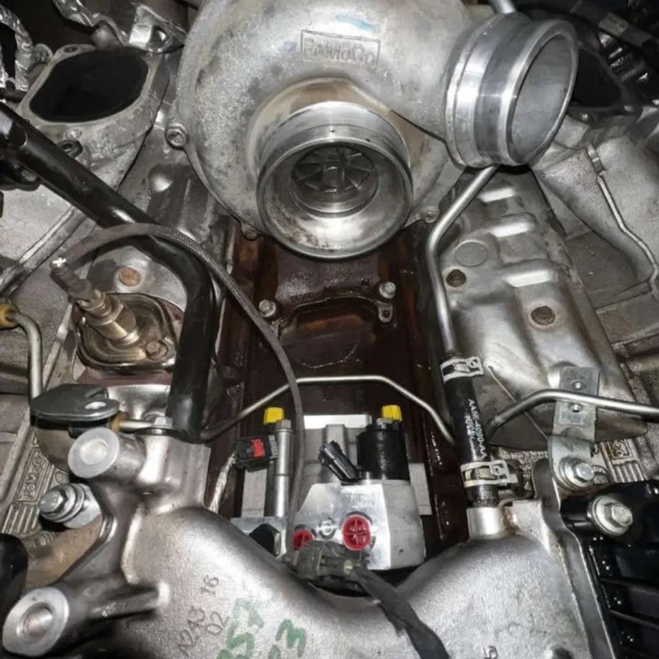 Ford Power Stroke diesel turbocharger and high-pressure fuel system during repair in Arab Alabama