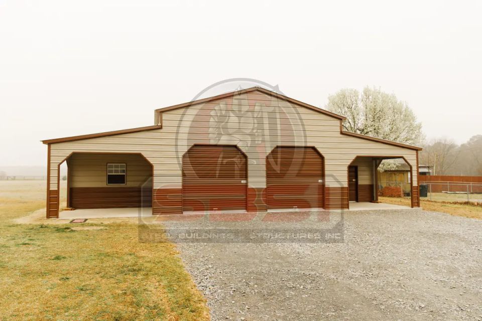 Tan and brown steel barn with open carport bays and center garage doors with SBSI watermark representing steel barns in Alabama