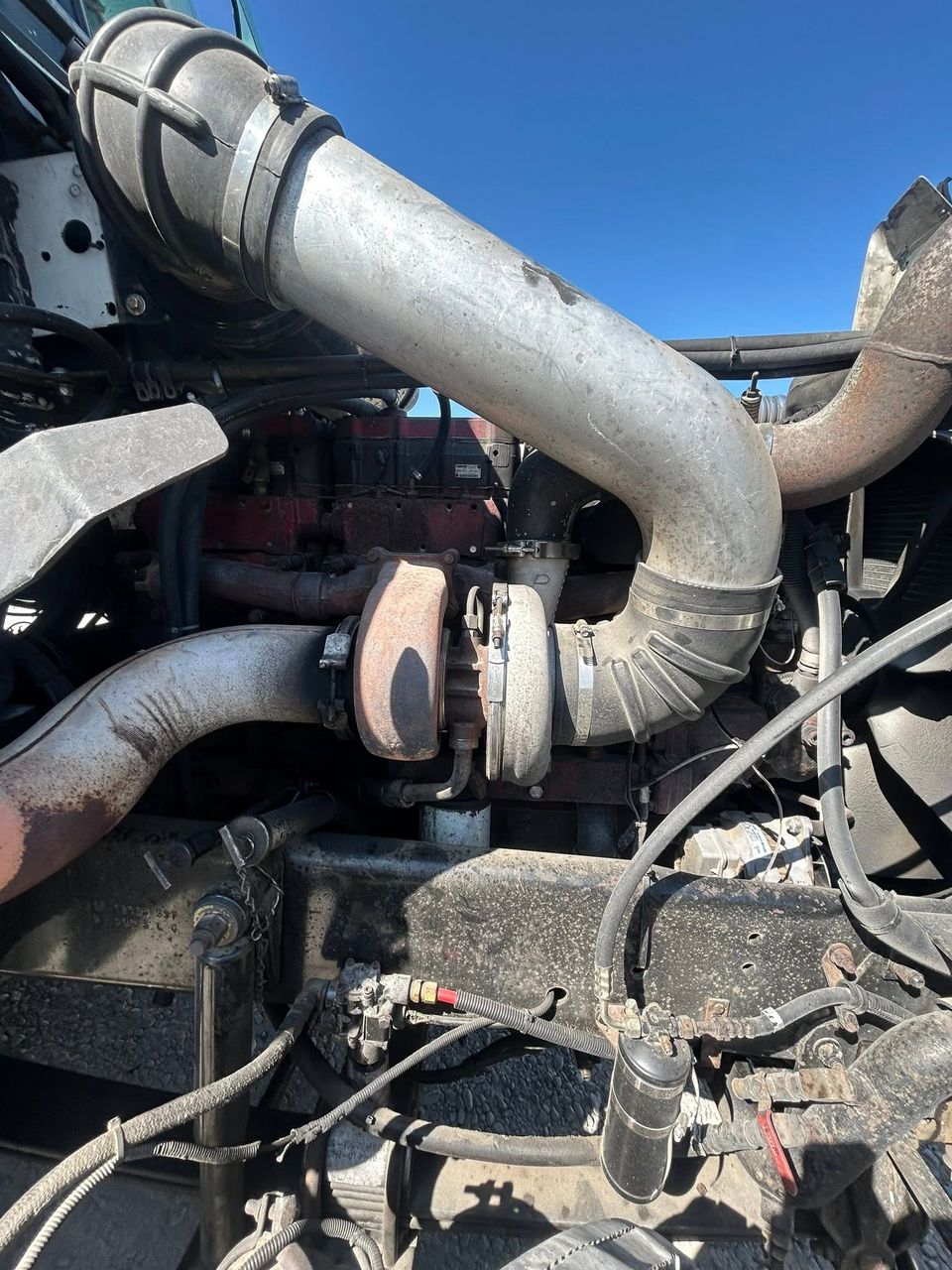 Cummins diesel engine turbocharger and intake piping during semi-truck repair in Arab Alabama