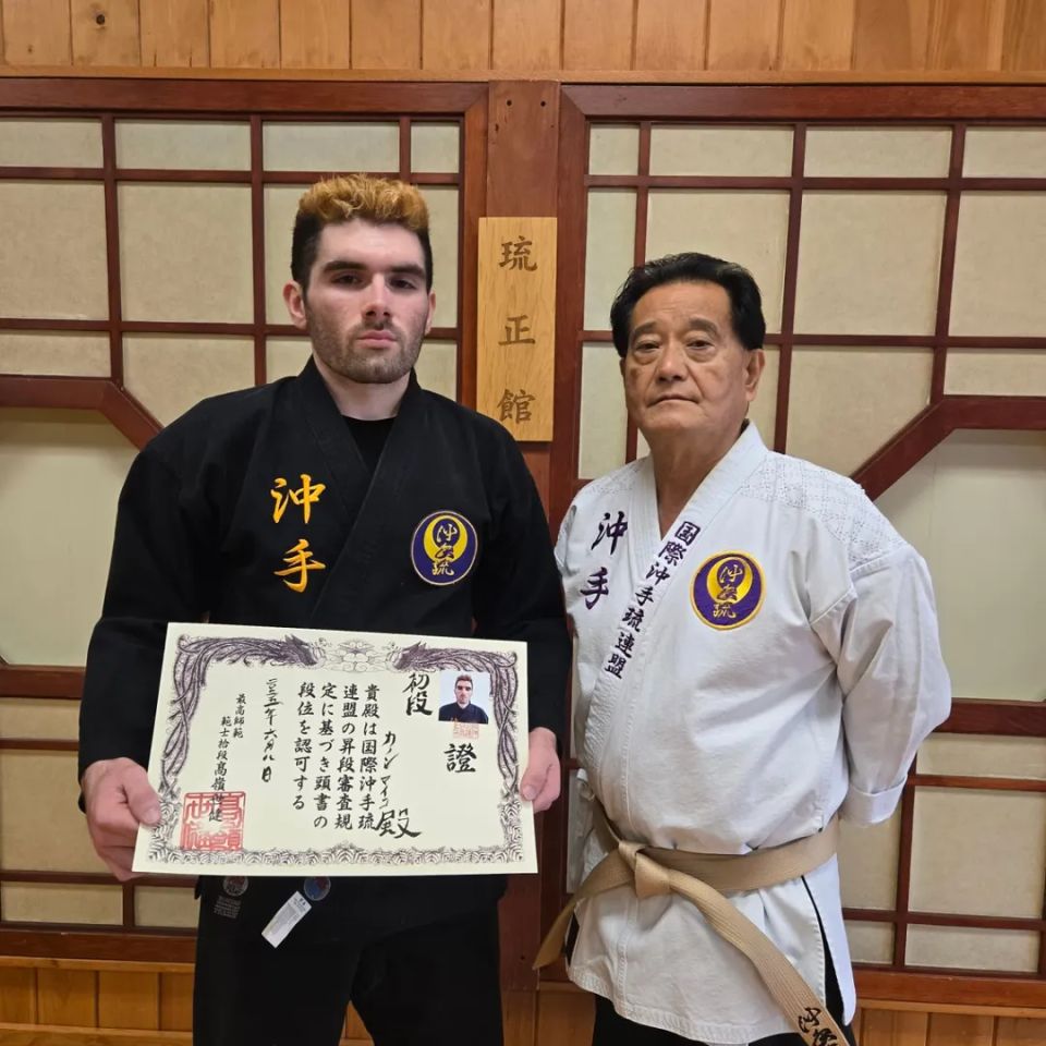 Hanshi Takamine with Mike, a black belt student at Takamine Karate Dojo in Miller Place