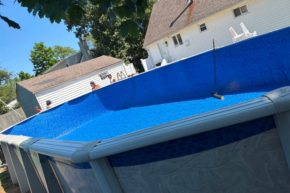 New liner installed in an oval above ground pool during a Long Island liner replacement