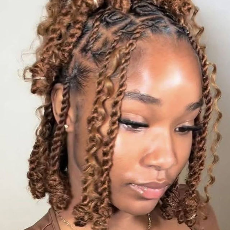 Short honey blonde spring twists styled on a client after a braiding service in Los Angeles CA