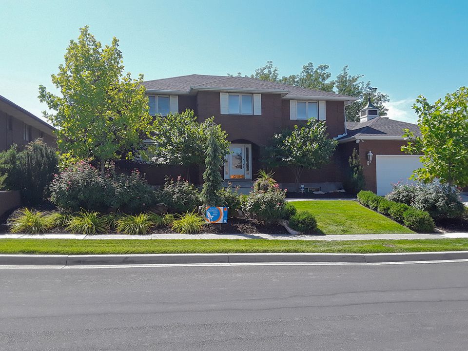 Meticulously well tended grass and flower gardens in salt lake valley