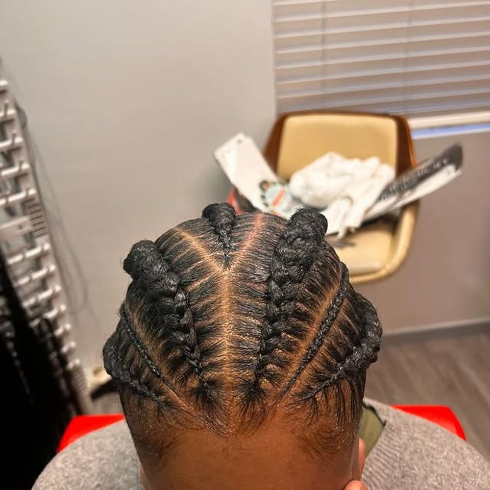Overhead view of neat stitch cornrow braids with knots after a braiding service in Los Angeles CA