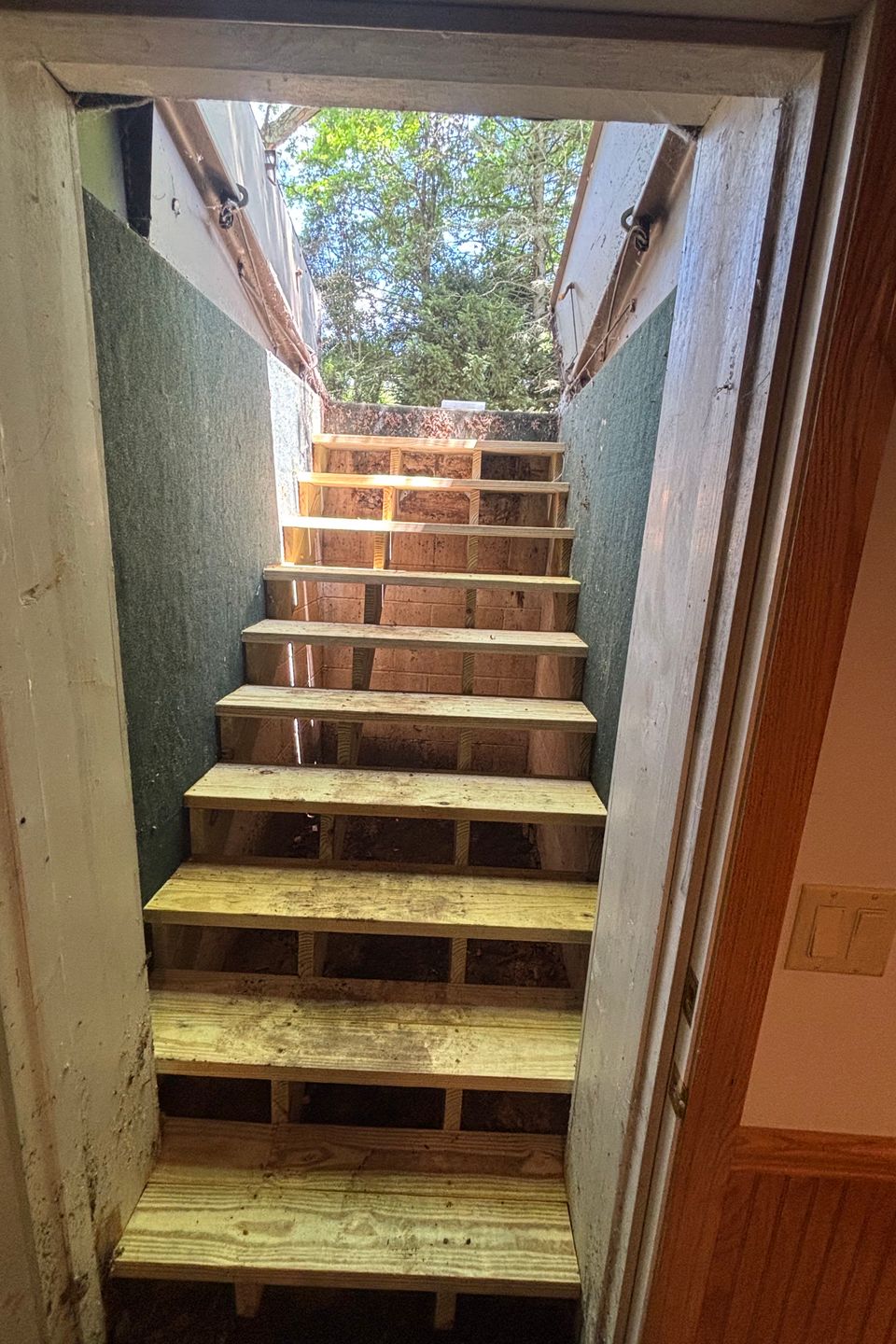 New exterior stairs provide safe, durable access while improving the functionality of below-grade entrances.
