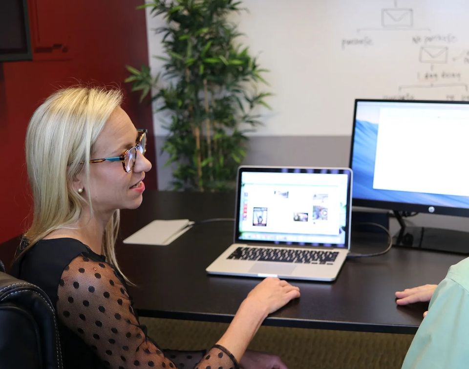 Young lady telling web design company in Grand Island, Nebraska about her business so they can begin designing her website in as little as 24 hours.