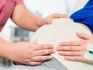 Midwife or nurse in delivery r 224509423