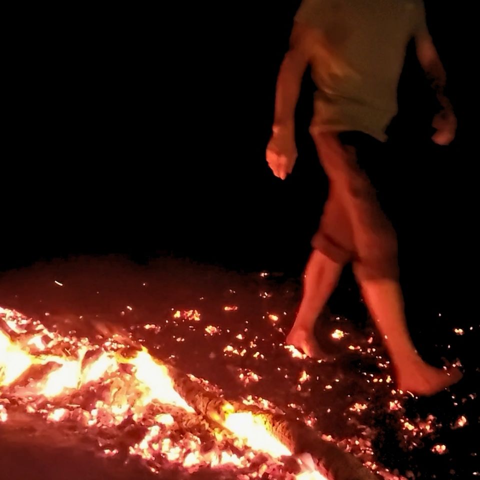 firewalking experience participant walking across hot coals