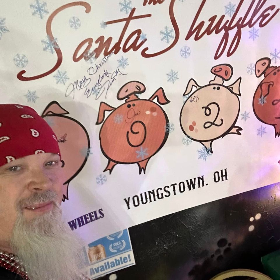 Santa Shuffle Youngstown, Ohio event banner decorated with holiday-themed graphics.