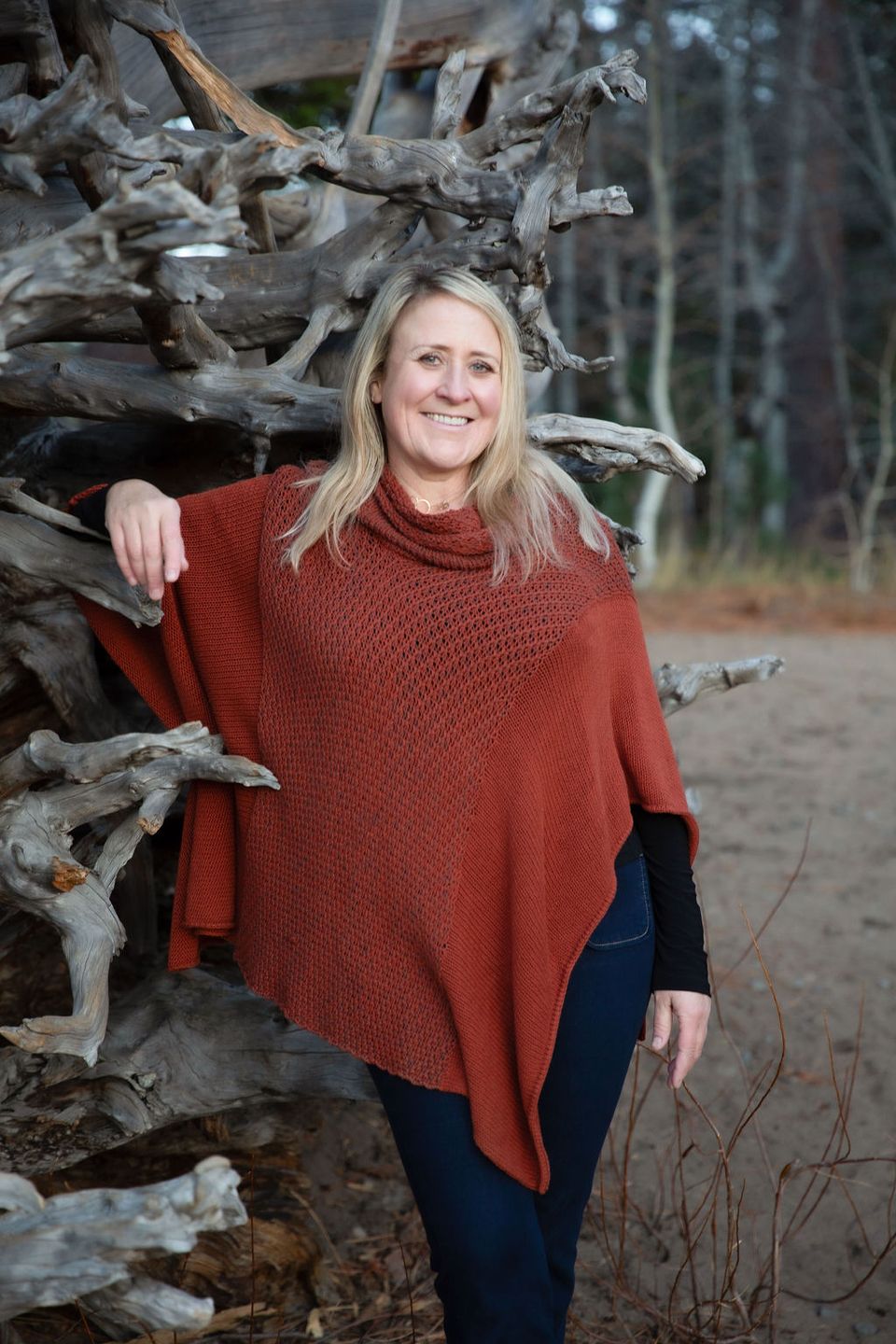 KPCopy in front of her favorite overturned tree leaning against the roots with her orange shawl 