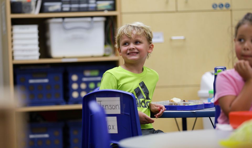 Boy listening teacher