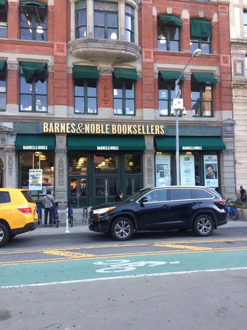 Green storefront awnings with printed Barnes & Noble lettering across the ground floor, with matching awnings over the upper windows, at Union Square in Manhattan