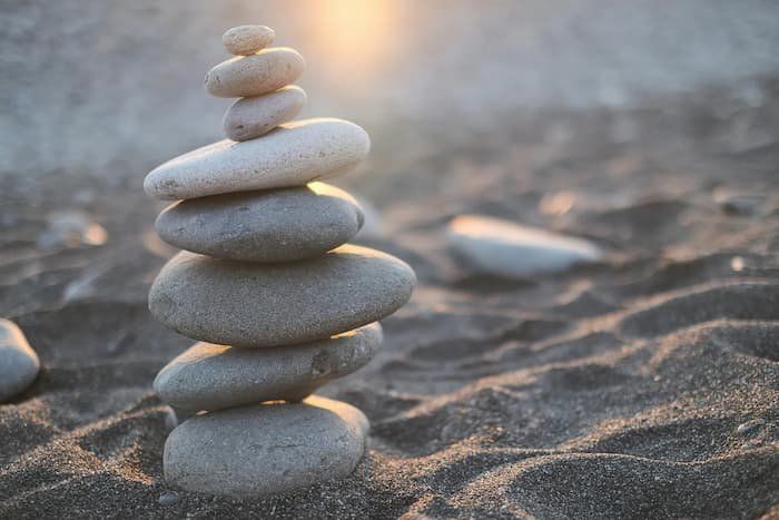 Balancing stones on a beach