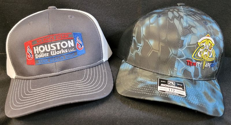 Embroidered logos on gray baseball caps