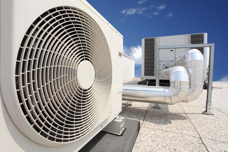 Air conditioning units on a rooftop with blue sky 2026 01 09 11 21 00 utc (1)